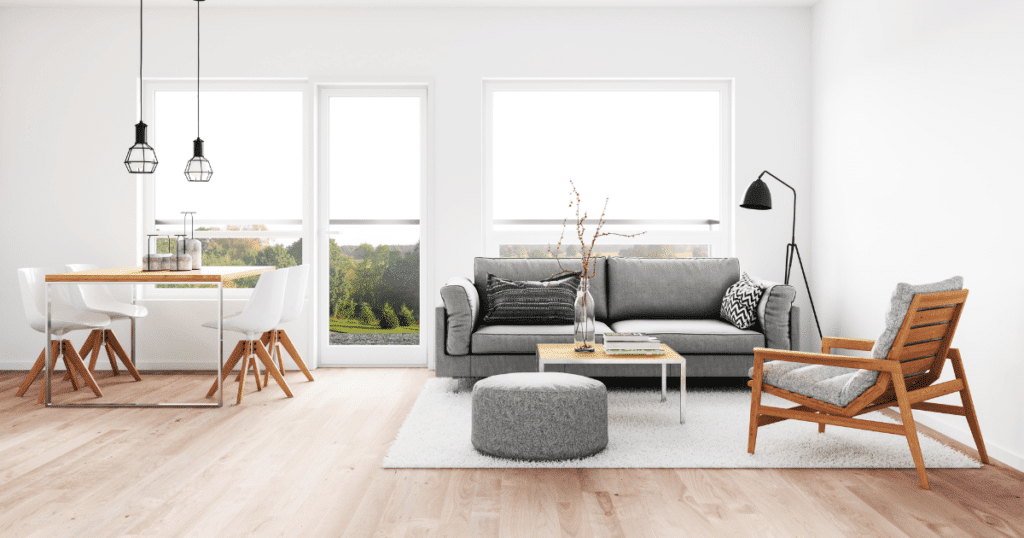 A living room/dining room with bright, white walls.