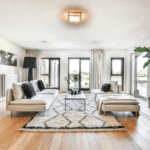 Living room with hardwood floors and white, neutral walls.