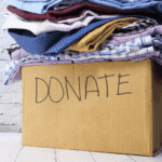 Donate box with clothes inside it.