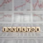 Wooden blocks put together to spell "Investor".